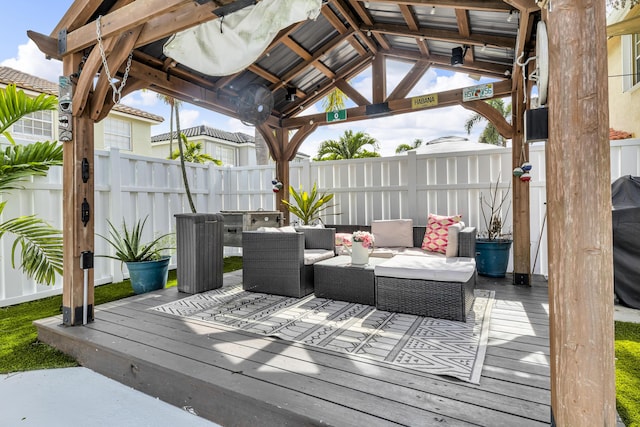 wooden deck with a gazebo and an outdoor hangout area