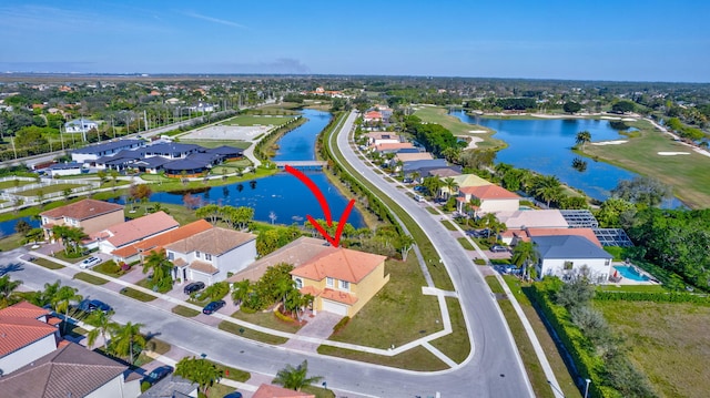 birds eye view of property featuring a water view