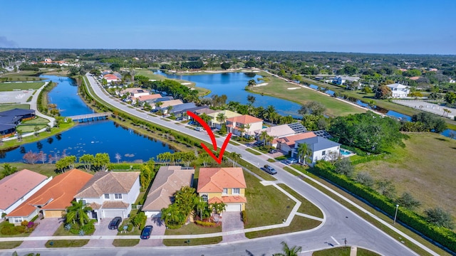 birds eye view of property featuring a water view