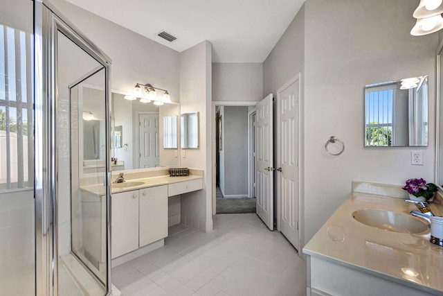 bathroom with an enclosed shower and vanity