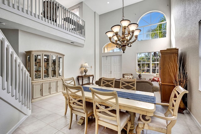 dining room featuring a high ceiling and a notable chandelier