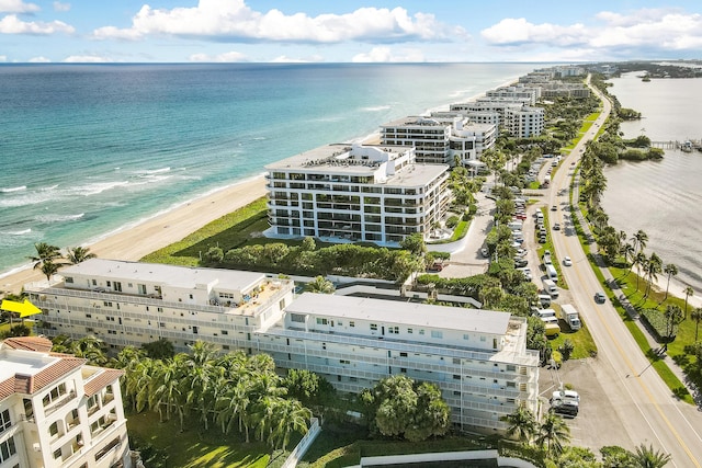 drone / aerial view featuring a view of the beach and a water view