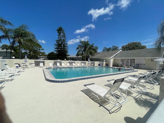 view of swimming pool with a patio area