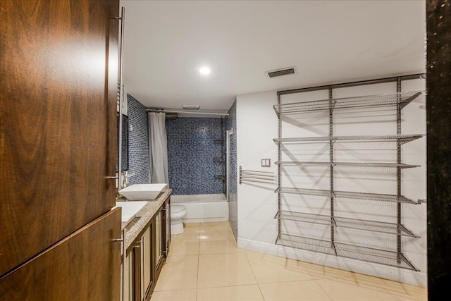 full bathroom with toilet, vanity, tile patterned flooring, and shower / bathtub combination with curtain