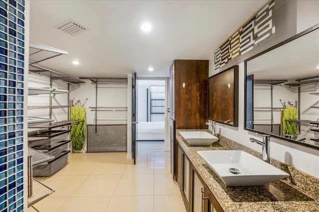 bathroom featuring vanity and tile patterned flooring