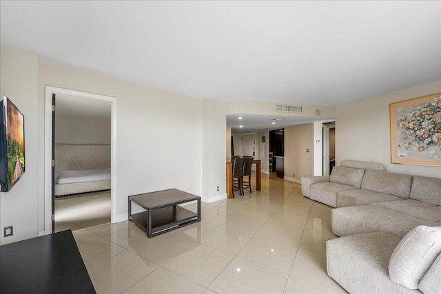 living room with light tile patterned flooring