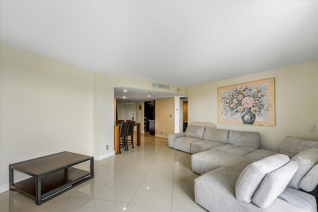 living room with light tile patterned floors