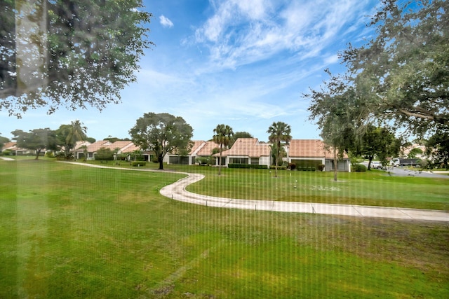 surrounding community featuring a lawn