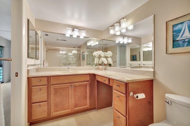 bathroom featuring an enclosed shower, vanity, tile patterned floors, and toilet