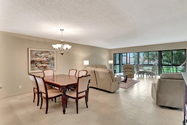 dining space with a chandelier