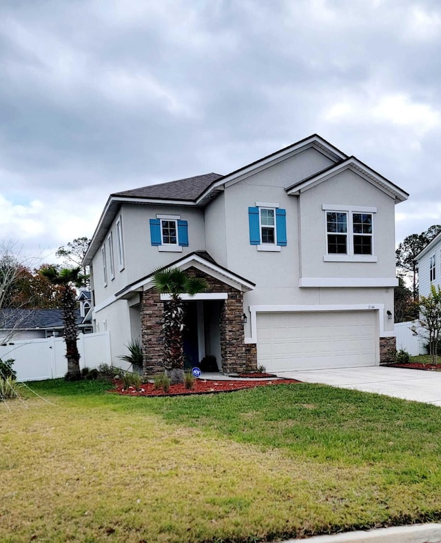 view of front property featuring a front lawn and a garage