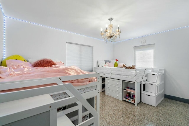 bedroom with a notable chandelier