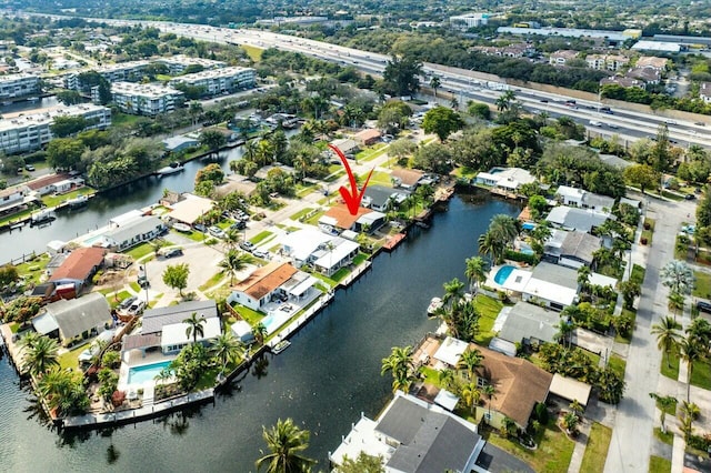 birds eye view of property featuring a water view