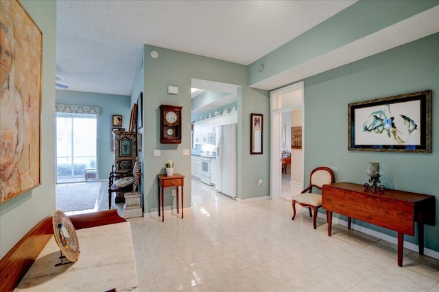 hallway featuring a textured ceiling