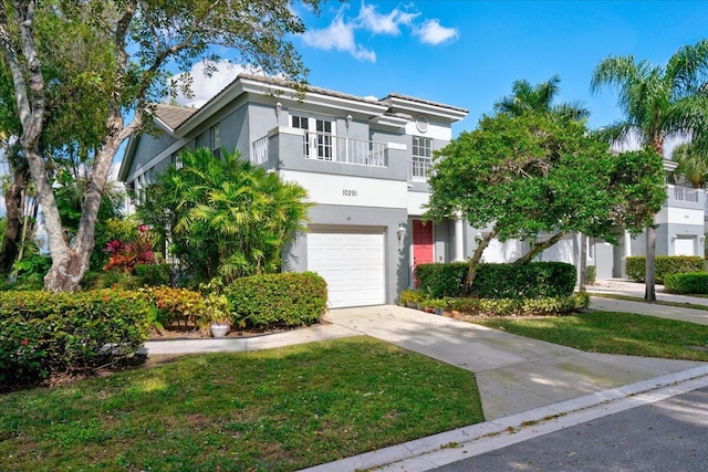 view of front of property with a balcony and a garage