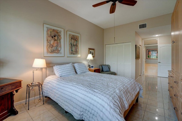 bedroom with a closet, vaulted ceiling, and ceiling fan