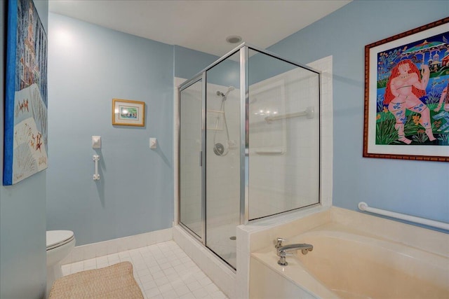 bathroom featuring tile patterned floors, toilet, and separate shower and tub