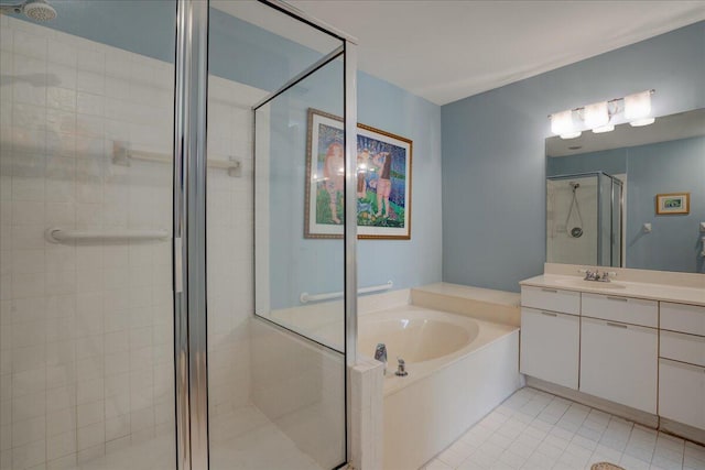 bathroom with tile patterned flooring, shower with separate bathtub, and vanity