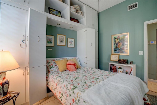 bedroom featuring light tile patterned floors