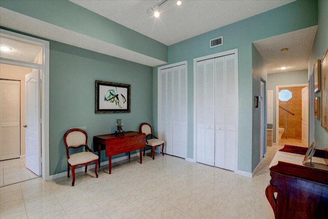 living area with a textured ceiling