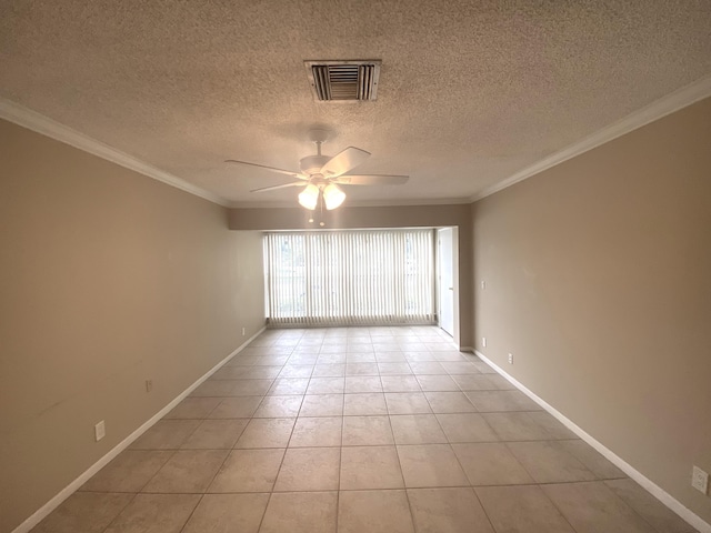 spare room featuring light tile patterned floors, crown molding, and ceiling fan