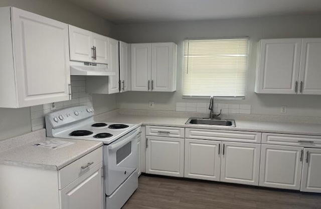 kitchen with white cabinets, white range with electric cooktop, dark hardwood / wood-style floors, and sink