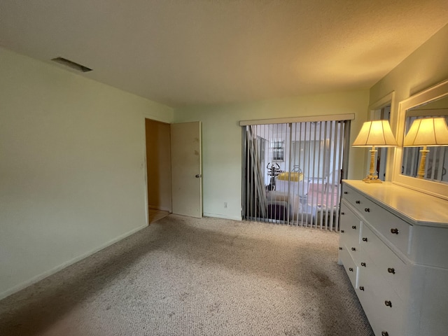 unfurnished bedroom featuring light colored carpet