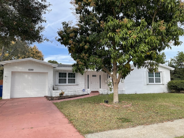 single story home with a garage and a front yard