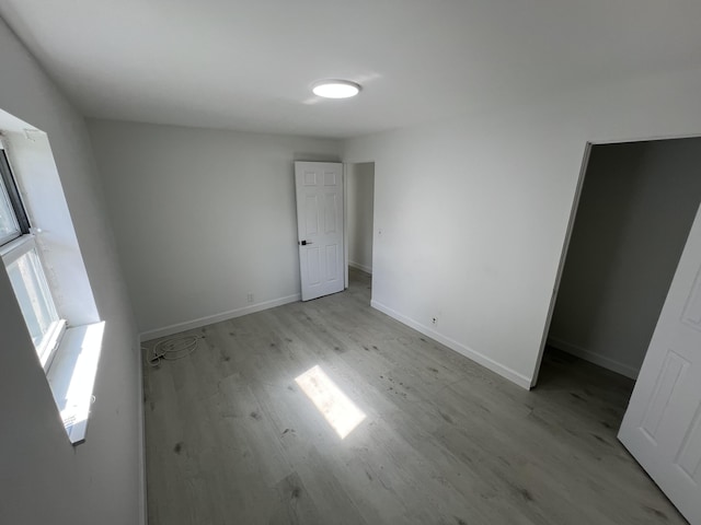 unfurnished room featuring light hardwood / wood-style floors