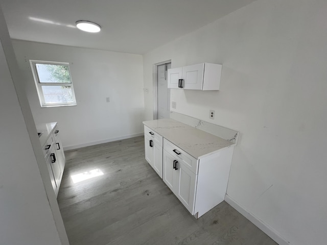 washroom with light wood-type flooring