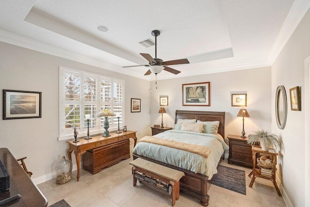 bedroom with ornamental molding, a raised ceiling, and ceiling fan