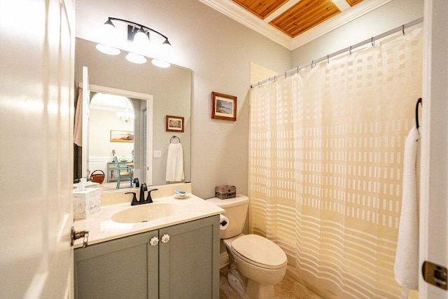 bathroom with crown molding, vanity, and toilet