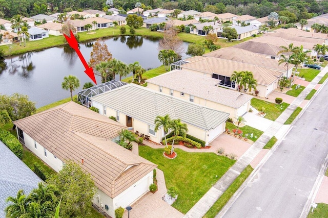 drone / aerial view with a water view