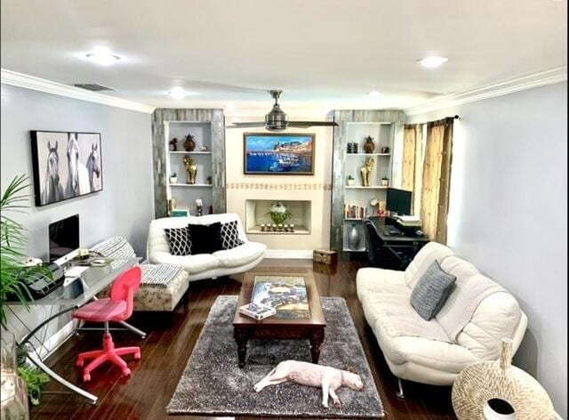 living room featuring dark wood-type flooring and ornamental molding