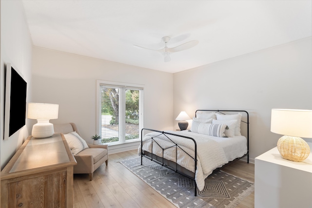 bedroom featuring ceiling fan and wood finished floors