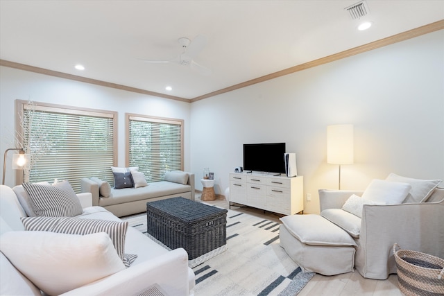 living room featuring a ceiling fan, visible vents, crown molding, and recessed lighting