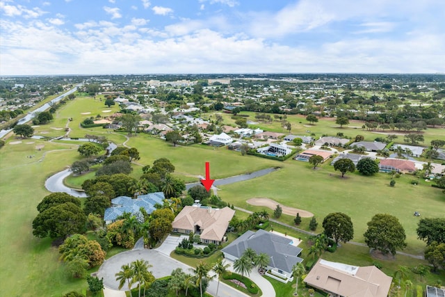 aerial view with a residential view and view of golf course