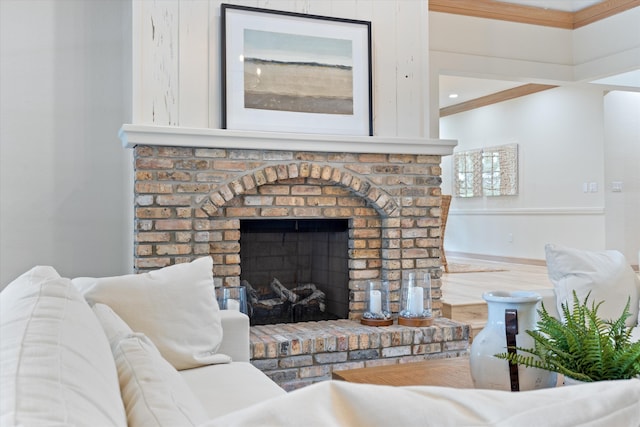 living area featuring a fireplace and wood finished floors