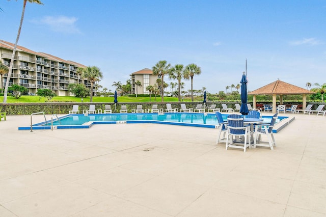 view of swimming pool featuring a gazebo and a patio