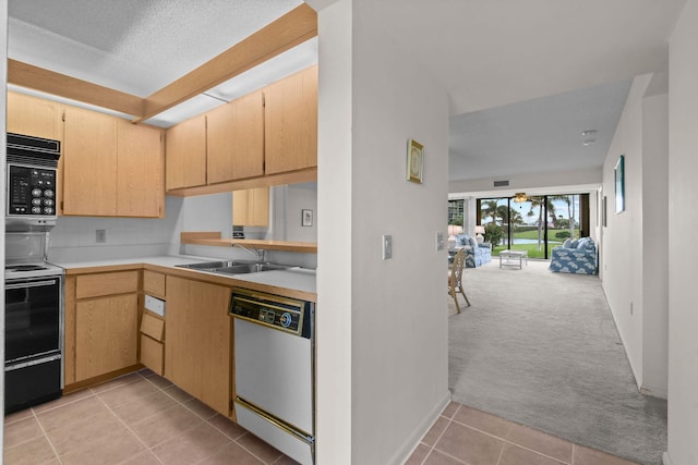 kitchen with sink, light brown cabinetry, dishwasher, electric range, and light carpet