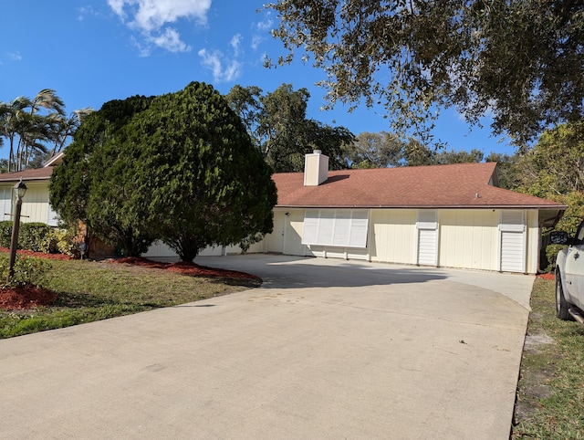 view of front of house with a garage and a front yard