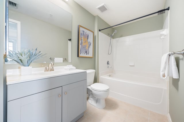 full bathroom featuring toilet, vanity, tile patterned floors, and shower / tub combination