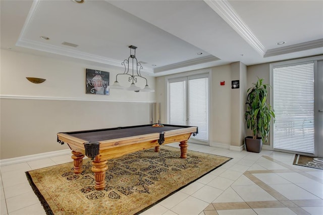 game room with light tile patterned floors, a tray ceiling, and ornamental molding