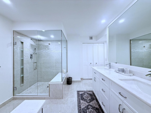 bathroom featuring vanity, tile patterned flooring, and an enclosed shower