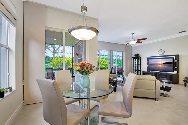 tiled dining area with crown molding and beverage cooler