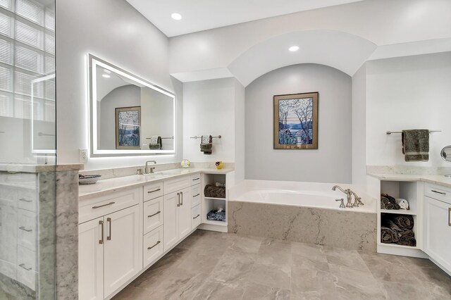 bathroom with vanity and plus walk in shower