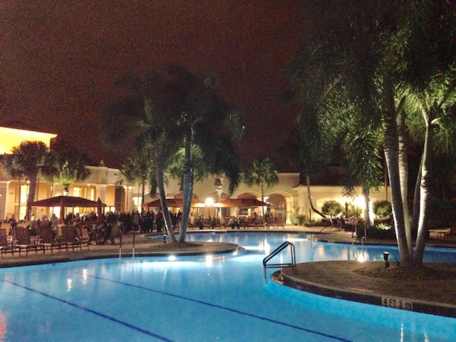 view of pool at night