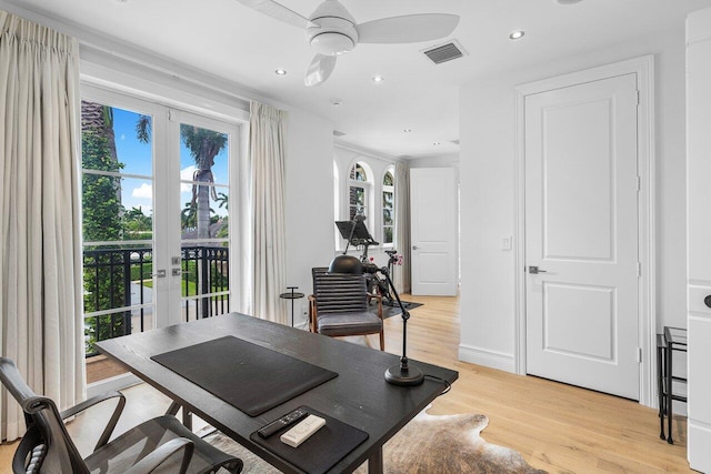 office space with ceiling fan, a wealth of natural light, light hardwood / wood-style floors, and french doors