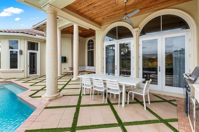 view of patio featuring ceiling fan and french doors