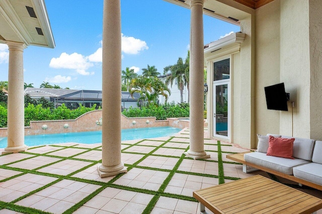 view of pool featuring pool water feature and a patio